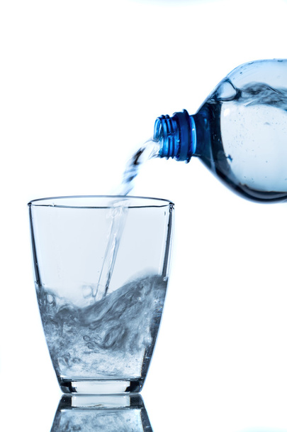 Pour water into a glass - Foto, Imagen