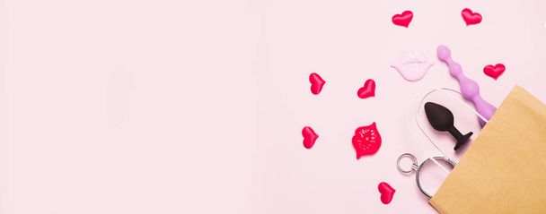 Adult sex toys and accessories on pink background. - Valokuva, kuva
