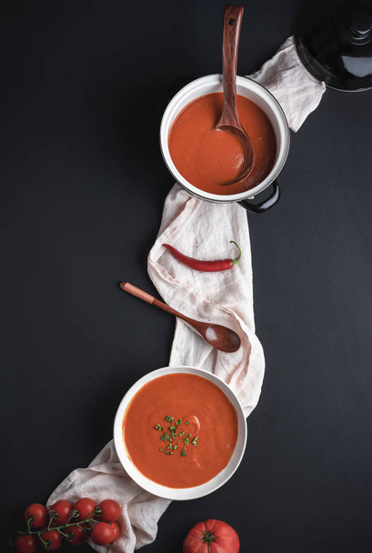 Healthy tomato soup on black table. Dinner table - Valokuva, kuva