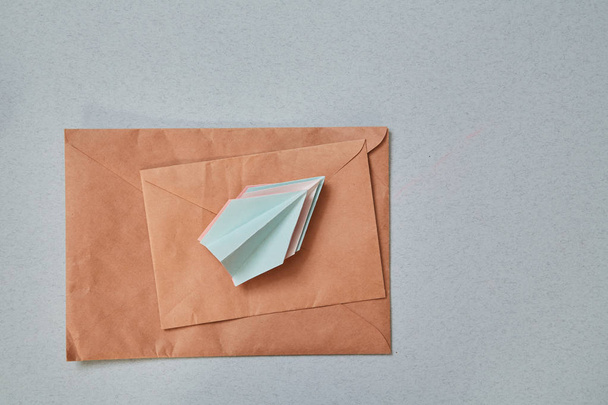 e-commerce business. Email marketing or advertising concept: A stack of paper airplanes and envelopes. - 写真・画像