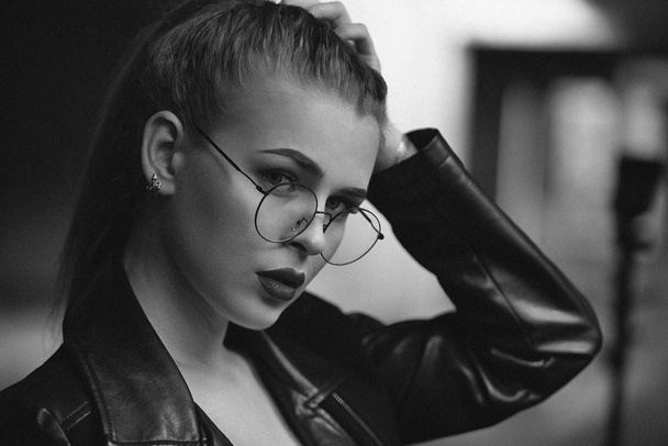 black and white portrait close-up of a beautiful romantic woman with glasses - Фото, зображення