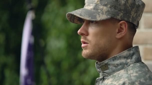 Thoughtful army veteran taking military cap, memorial day, post-traumatic stress - Materiał filmowy, wideo