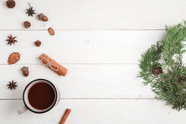 new year background. cinnamon,anise stars,fir branches and a Cup - Foto, Imagen