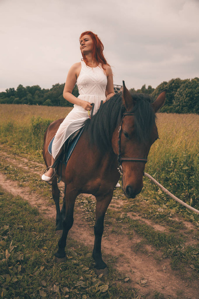 Beautiful girl with her horse walking together - Zdjęcie, obraz