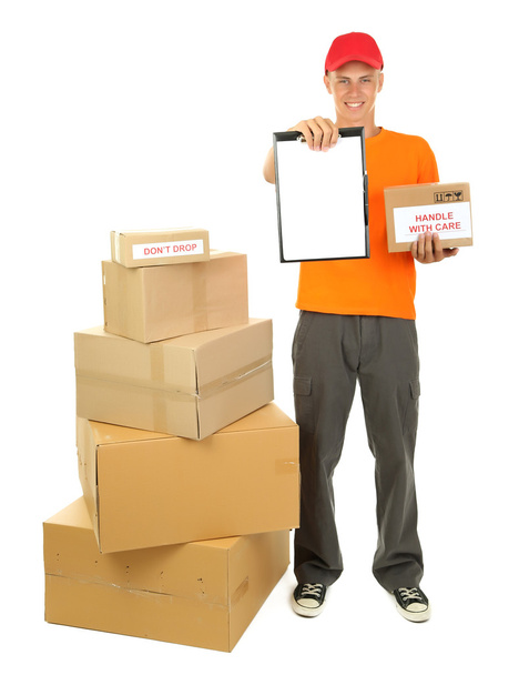 Young delivery man with parcels and clipboard, isolated on white - Photo, image