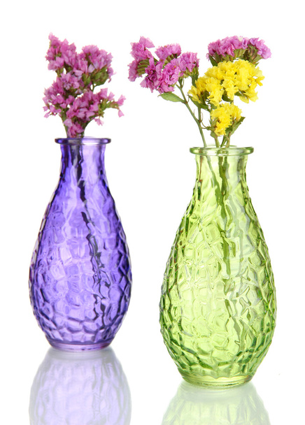 Beautiful summer flowers in vases isolated on white - 写真・画像