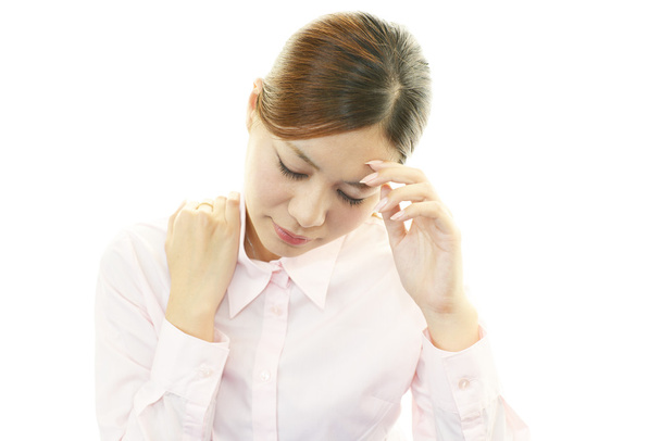 Young woman having a headache - Foto, afbeelding