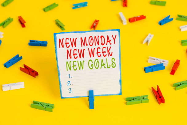 Handwriting text New Monday New Week New Goals. Concept meaning showcasing next week resolutions To do list Colored clothespin papers empty reminder yellow floor background office. - Photo, Image
