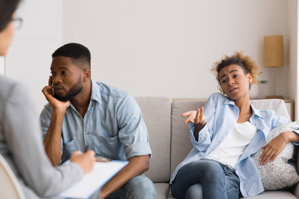 Afro Husband Looking Away While Wife Complaining To Marital Counselor - Фото, зображення