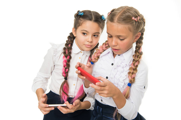 Digital technology for teaching and learning. Small children using mobile technology in classroom isolated on white. Promoting technology in education. The benefits of educational technology - Valokuva, kuva