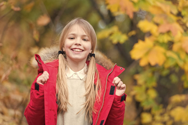 Happy little girl wear autumn fashion. Happy little girl smile outdoor. Be in fashion. Must have fashion for fall. Autumn is a second spring when every leaf is a flower - Foto, immagini