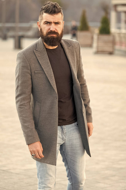 Urban fashion. Stylish casual outfit spring season. Menswear and male fashion concept. Man bearded hipster stylish fashionable coat or jacket. Comfortable outfit. Hipster fashion model outdoors - Foto, afbeelding