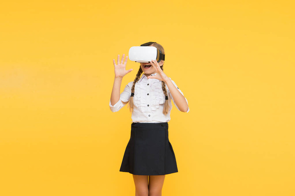 Testing new technologies. future education. back to school. Digital future and innovation. virtual reality. girl in VR headset. Small child wear wireless VR glasses. Happy kid use modern technology - 写真・画像
