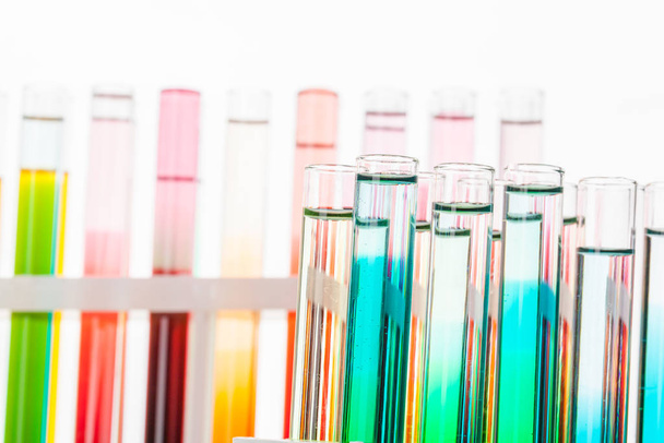 Glass laboratory chemical test tubes with liquid for analysis close up - Foto, Imagem