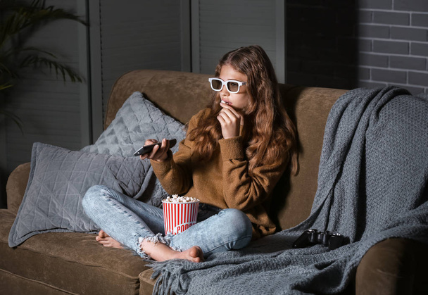 Teenage girl watching TV at night - Photo, Image