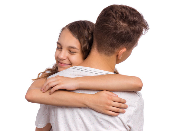 tiener jongen en meisje op wit - Foto, afbeelding