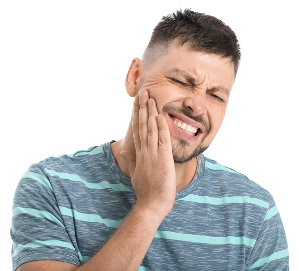 Man suffering from toothache against white background - Foto, Bild