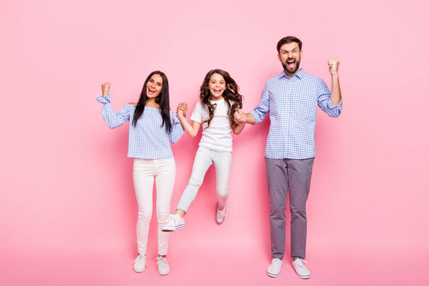 Full size photo of delighted people with brunet curly hair scream yeah raise fists wear t-shirt plaid blouse isolated over pink background - Fotografie, Obrázek