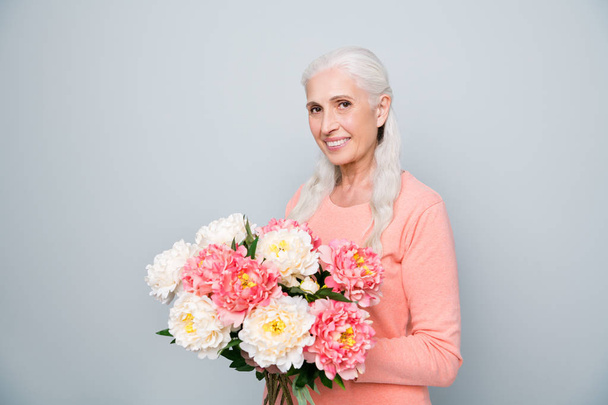 Photo portrait of nice positive glad sweet lovely dream dreamy wife holding big bouquet in hands from her husband isolated grey background - Fotoğraf, Görsel