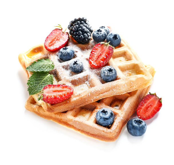 Tasty waffles with berries on white background - Foto, imagen