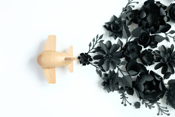 small wooden toy airplane lucky by flower - Фото, изображение
