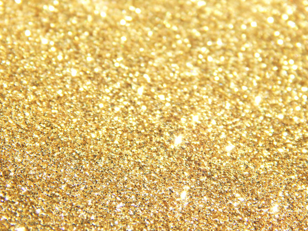 Onscherpe achtergrond met gouden glitter - Foto, afbeelding