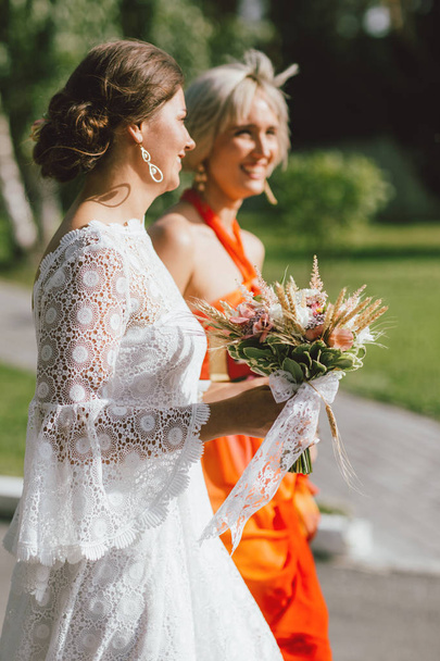 The happy bride and her best friend at wedding party, bridesmaids - Zdjęcie, obraz
