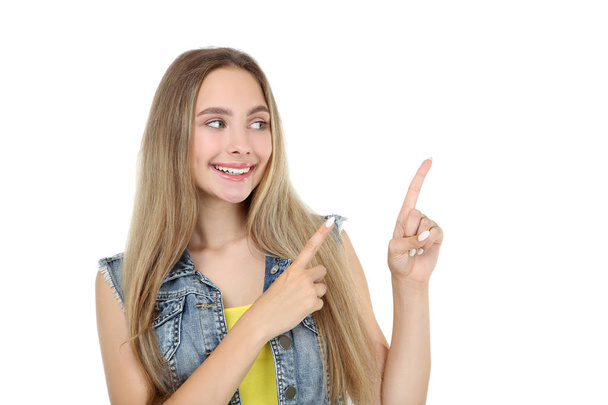 Beautiful young woman showing fingers up on white background - Zdjęcie, obraz