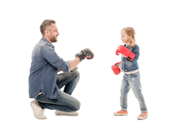 smiling dad and daughter with boxing gloves isolated on white - Foto, imagen