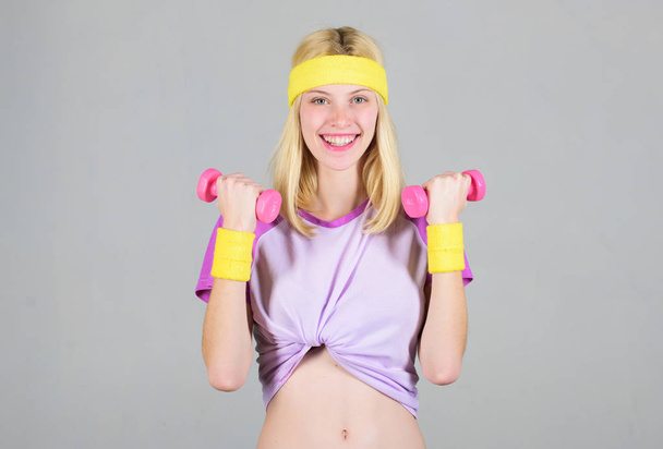 Find personal trainer. Workout with dumbbell. Workout sport and dieting. Woman fitness coach exercising with dumbbell. Easy biceps exercise. Woman workout in gym with sport equipment. Workout result - Fotografie, Obrázek