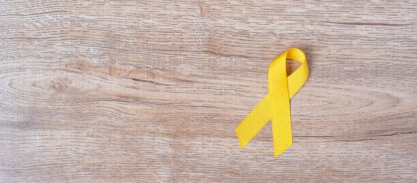Prevenzione del suicidio e consapevolezza del cancro infantile, nastro giallo
 - Foto, immagini