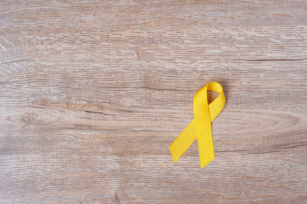 Prevención del suicidio y concienciación sobre el cáncer infantil, cinta amarilla
 - Foto, Imagen