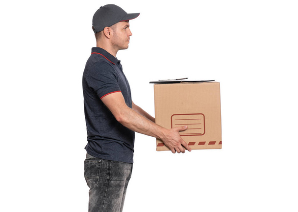 Delivery man in cap on white - Foto, Imagen