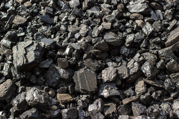 Pile of natural black hard coal for texture background. Grade anthracite coals often referred to as stone coal and black diamond coal. - Photo, Image