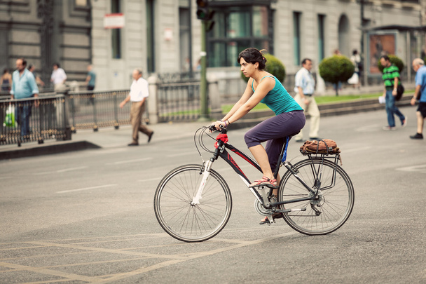 Woman Riding a Bike in Alcala Street, Madrid - Photo, Image