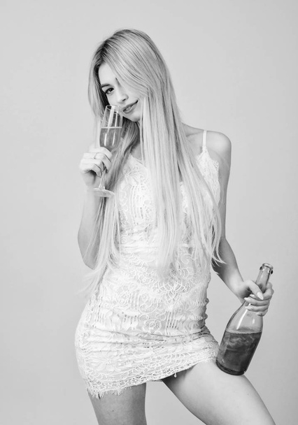 Glamorous party. Girl drinking pearl glitter champagne. Woman white dress bottle glass alcohol drink. Hen party concept. Luxury champagne. Pretty blonde celebrate birthday party. Sweet liquor - Fotografie, Obrázek