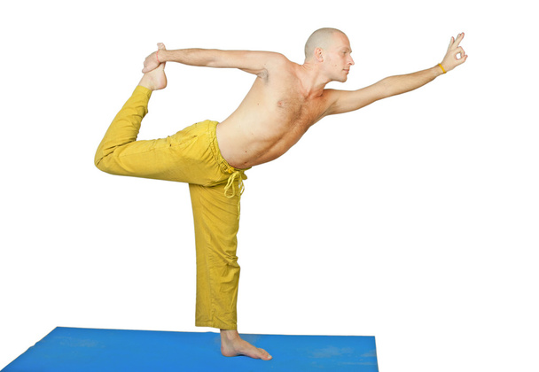 Yoga. Man in natarja asana position - Fotó, kép