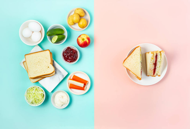 Trendy Korean sandwich inkigayo with ingredients on two-color pastel background, top view, horizontal - Photo, Image