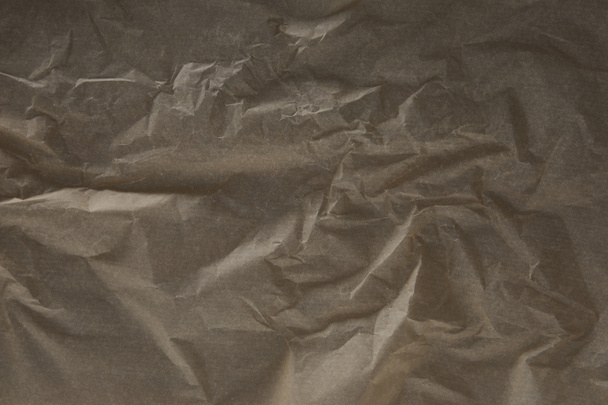 top view of dark beige wrinkled parchment paper surface with copy space - Photo, Image