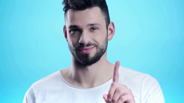 handsome man showing no gesture on blue  - Felvétel, videó