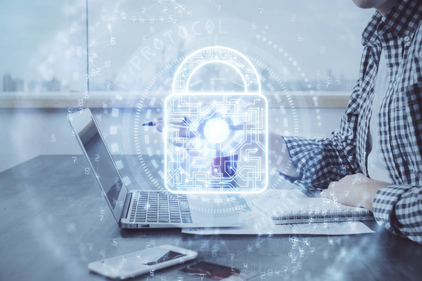 Double exposure of lock icon with man working on computer on background. Concept of network security. - Fotó, kép