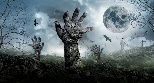 Le concept d'Halloween avec des zombies sortant du cimetière
. - Photo, image