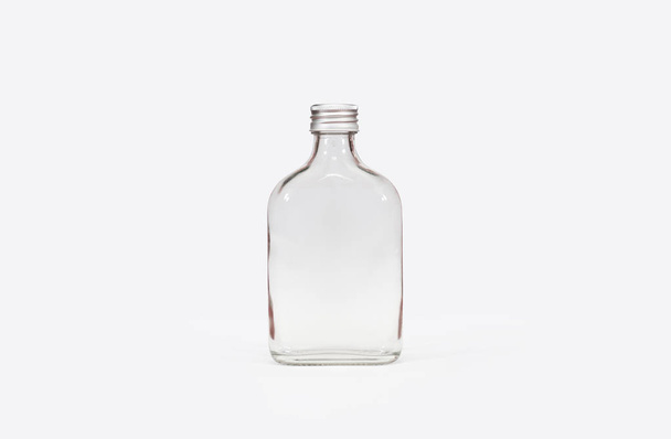 Isolated clear glass bottle white background with clipping path. - Photo, Image