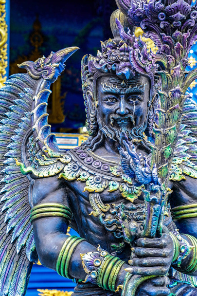 The Blue - Turquiose metalic God status in Thai blue temple, at
  - Фото, изображение