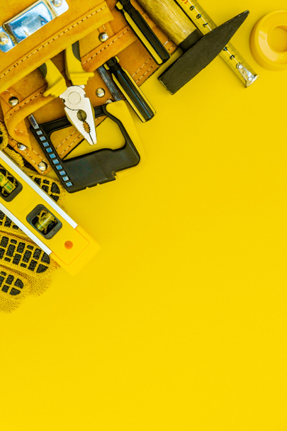 Professional tools for the joiner and spare parts on a yellow background. - Valokuva, kuva