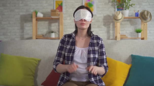 Young woman sleeping in a sleep mask - Felvétel, videó
