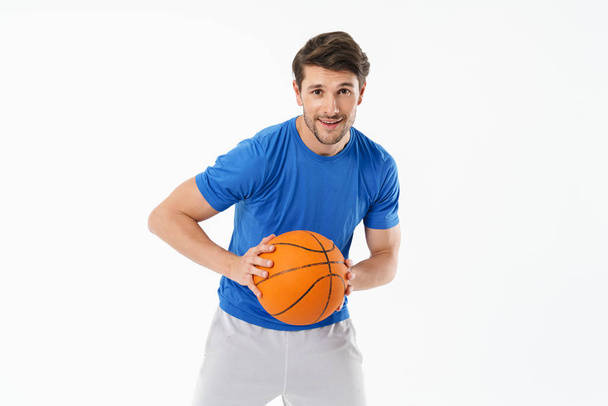 Attractive young fit sportsman wearing t-shirt standing - 写真・画像