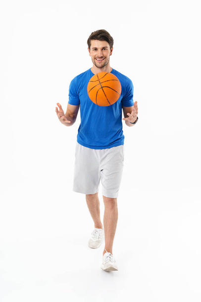 Attractive young fit sportsman wearing t-shirt standing - Zdjęcie, obraz