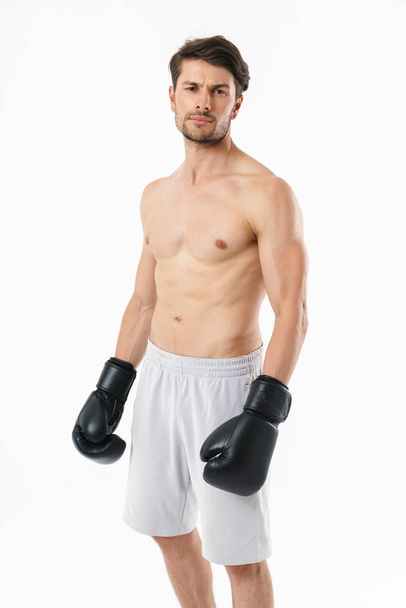 Handsome young fit shirtless sportsman standing - Fotoğraf, Görsel