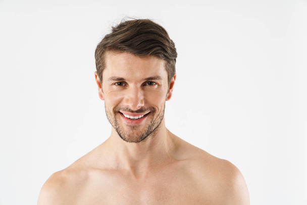 Close up of a handsome young shirtless man isolated - Foto, Imagen